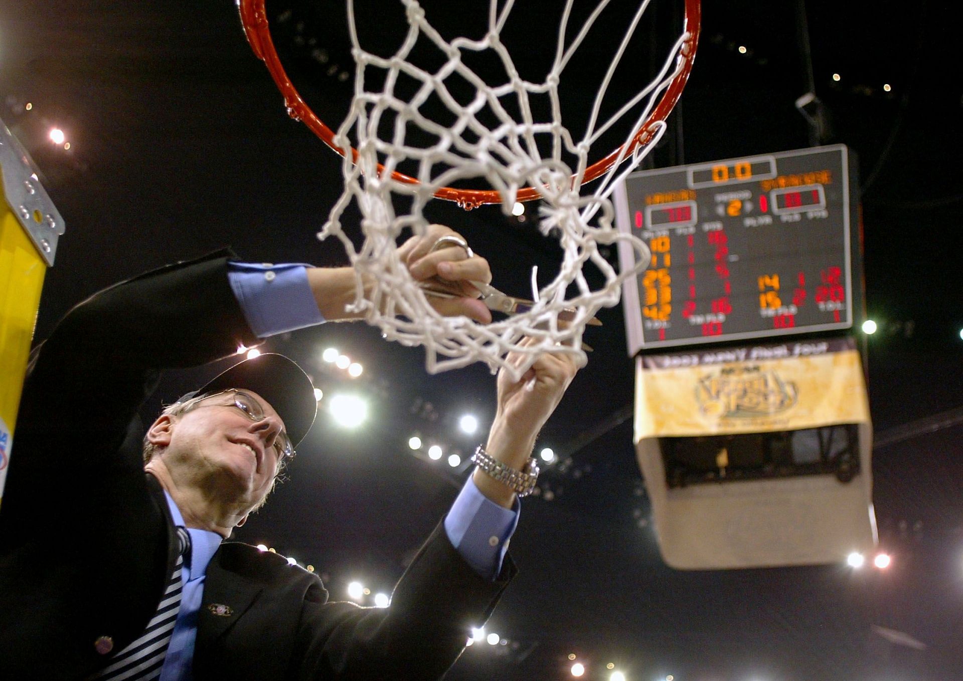 Jim Boeheim cuts down the net after Syracuse won the NCAA championship in 2003.