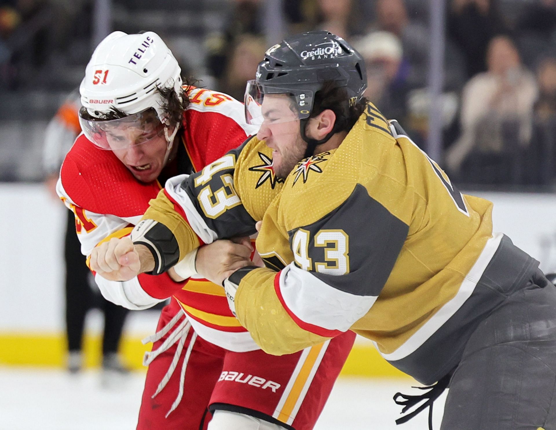 Troy Stecher #51 of the Calgary Flames and Paul Cotter #43 of the Vegas Golden Knights fight in the second period of their game at T-Mobile Arena on March 16, 2023 in Las Vegas, Nevada. (Photo by Ethan Miller/Getty Images)