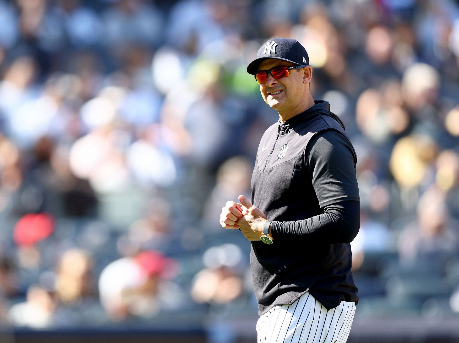 Manager Aaron Boone of the New York Yankees heads to the dugout after pulling starter Gerrit Cole at Yankee Stadium