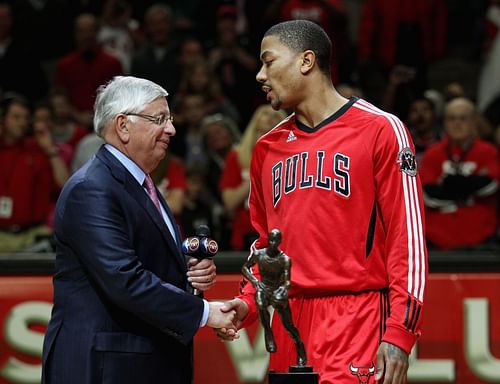 Derrick Rose #1 of the Chicago Bulls accepts the Maurice Podoloff Trophy awarded to the NBA Most Valuable Player from Commissoner David Stern