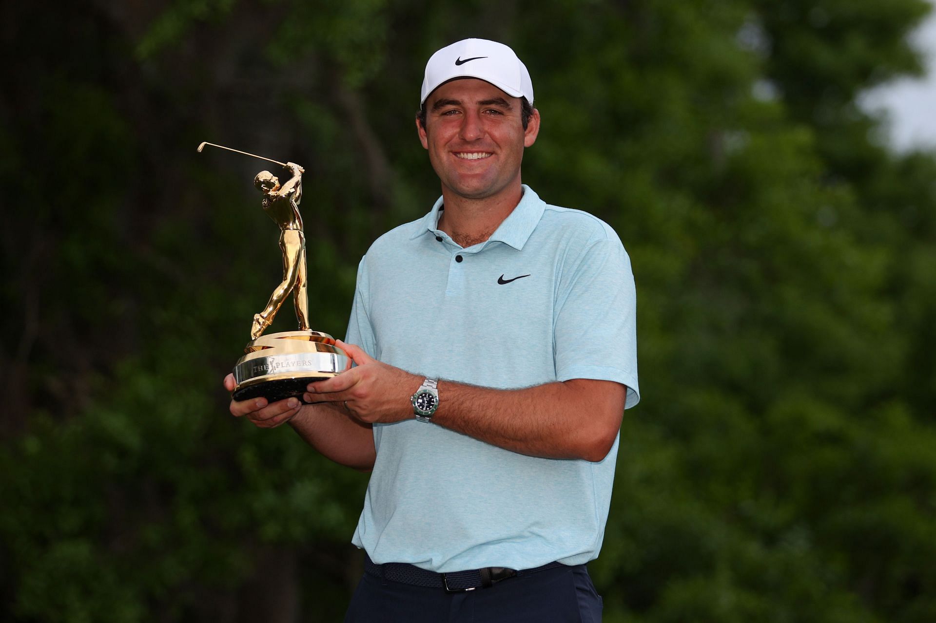 On March 12, 2023, in Ponte Vedra Beach, Florida, Scottie Scheffler of the United States celebrates with the trophy after winning during the final round of THE PLAYERS Championship on THE PLAYERS Stadium Course at TPC Sawgrass.