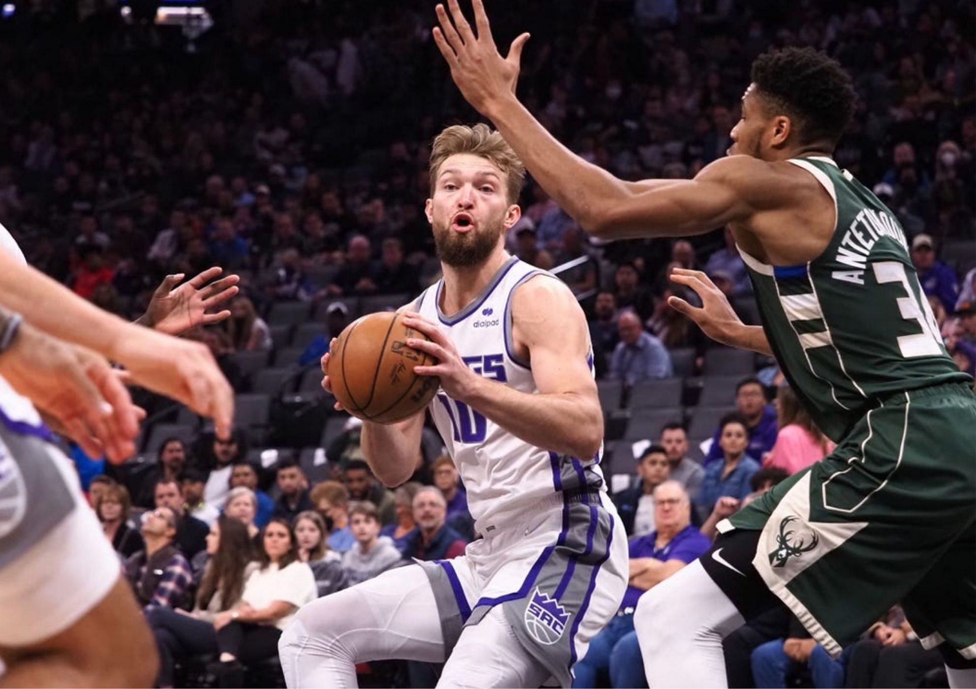 Giannis Antetokounmpo [R] is questionable tonight for the Milwaukee Bucks versus the Sacramento Kings. [photo: Sportsnaut]