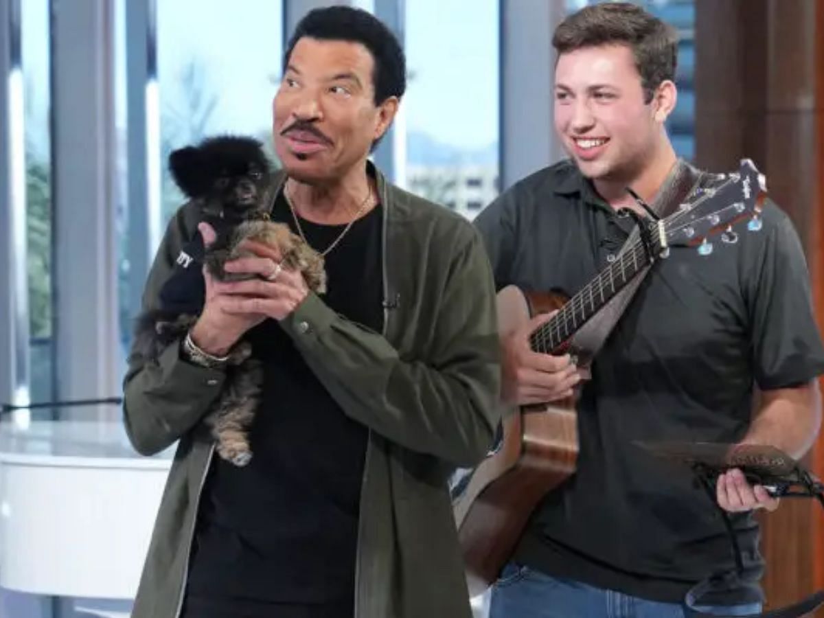 Pre-vet student Owen Eckhardt gets surprised with puppies (Image via Eric McCandless/ ABC)