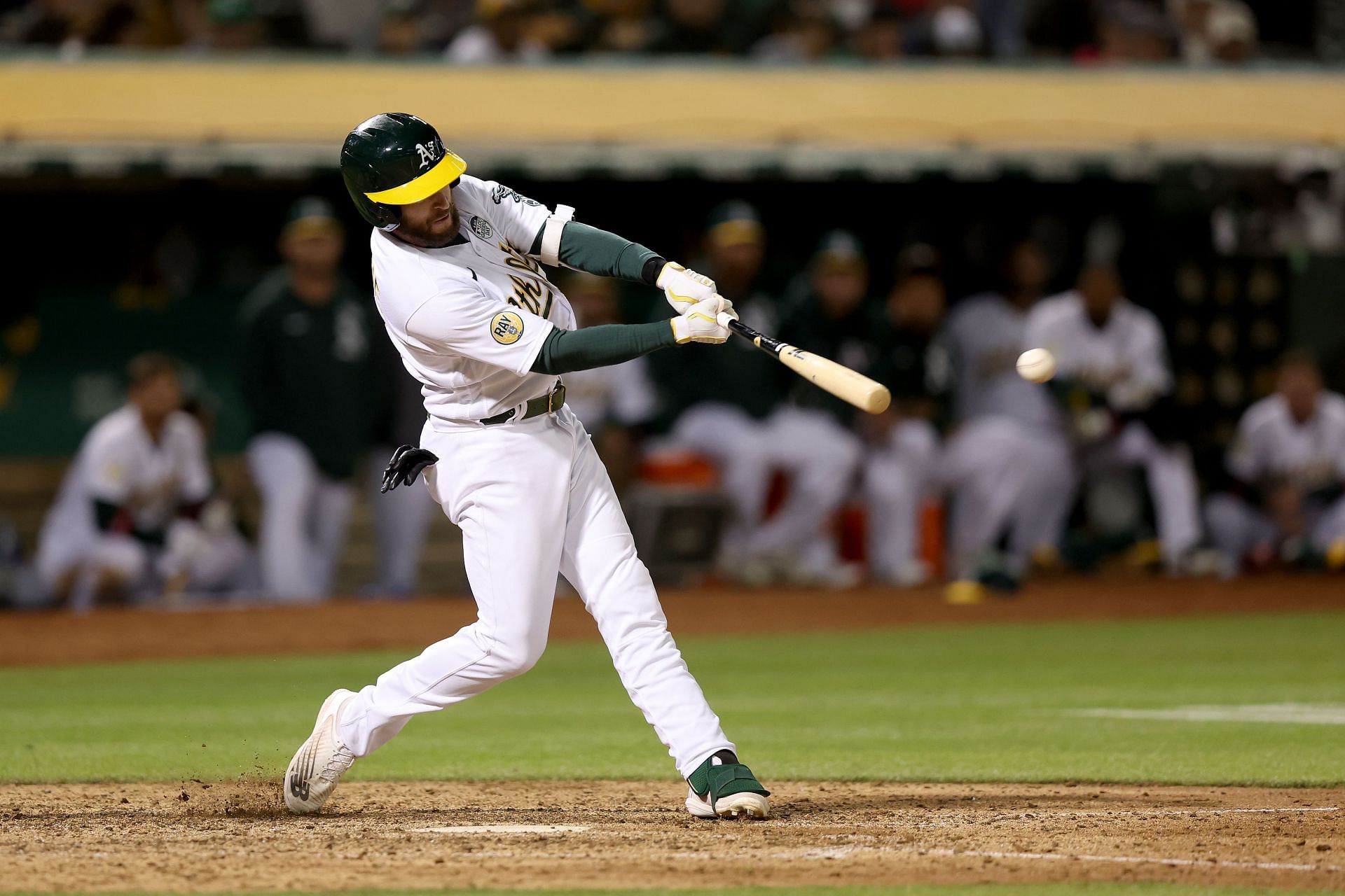 Jed Lowrie of the Oakland Athletics hits a double.