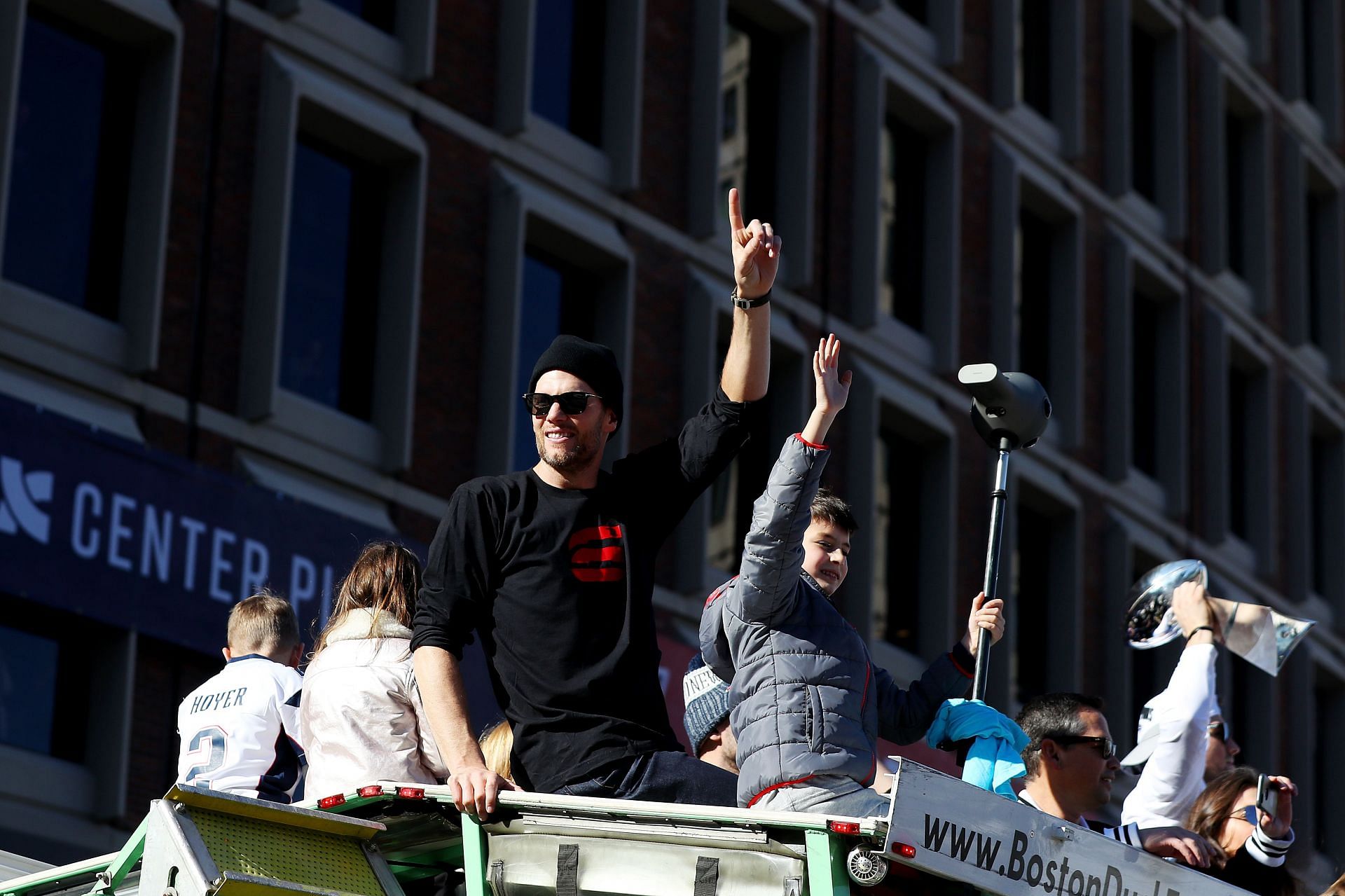 Tom Brady and Jack celebrate at New England Patriots Victory Parade
