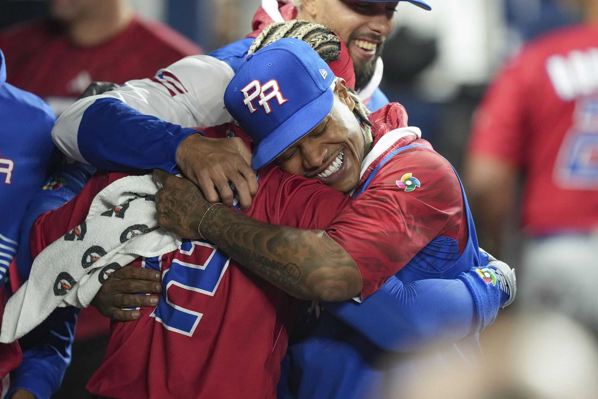 Marcus Stroman of Puerto Rico hugs Francisco Lindor (12) during the World Baseball Classic.