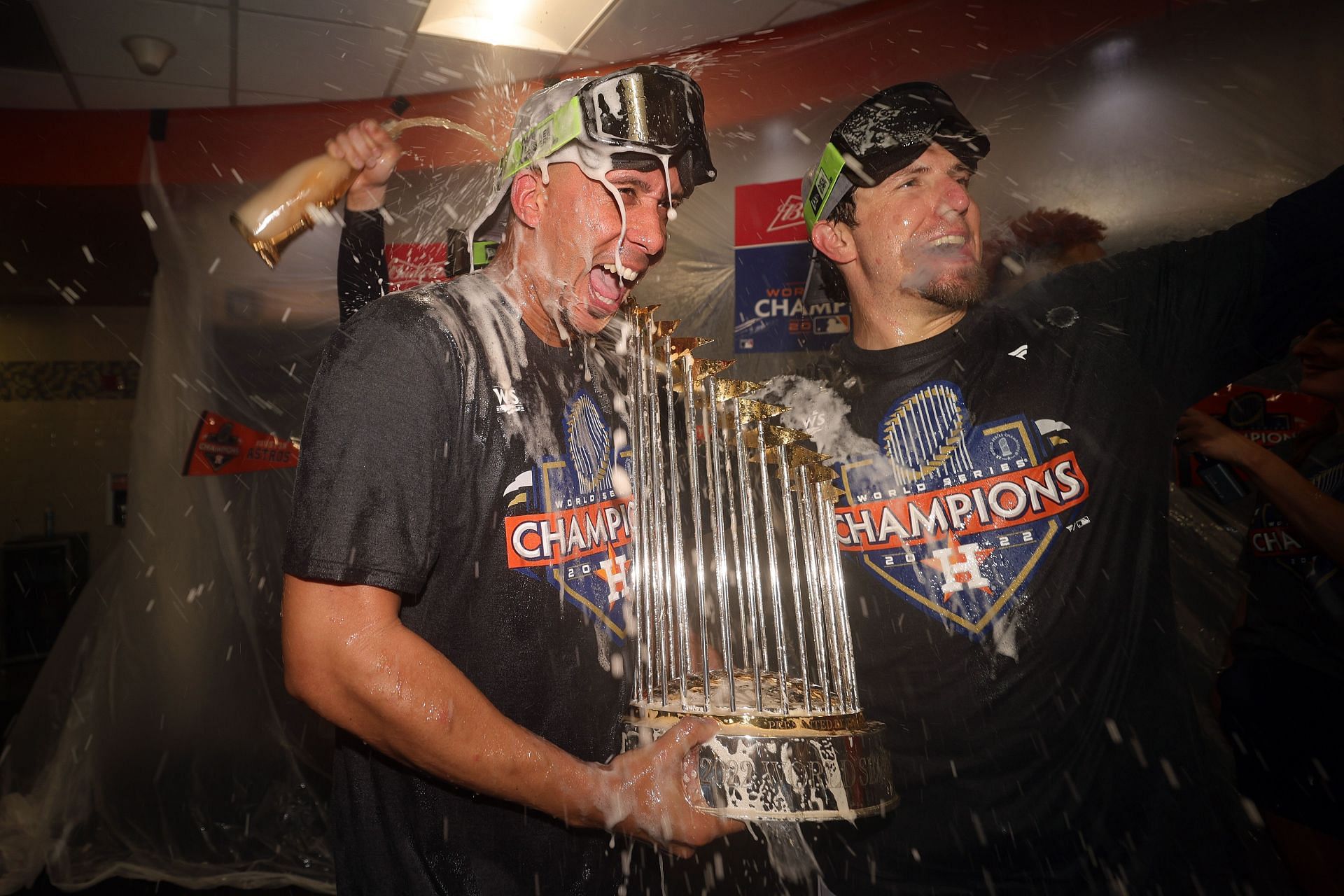 Michael Brantley of the Houston Astros celebrates while holding the commissioner&#039;s trophy.