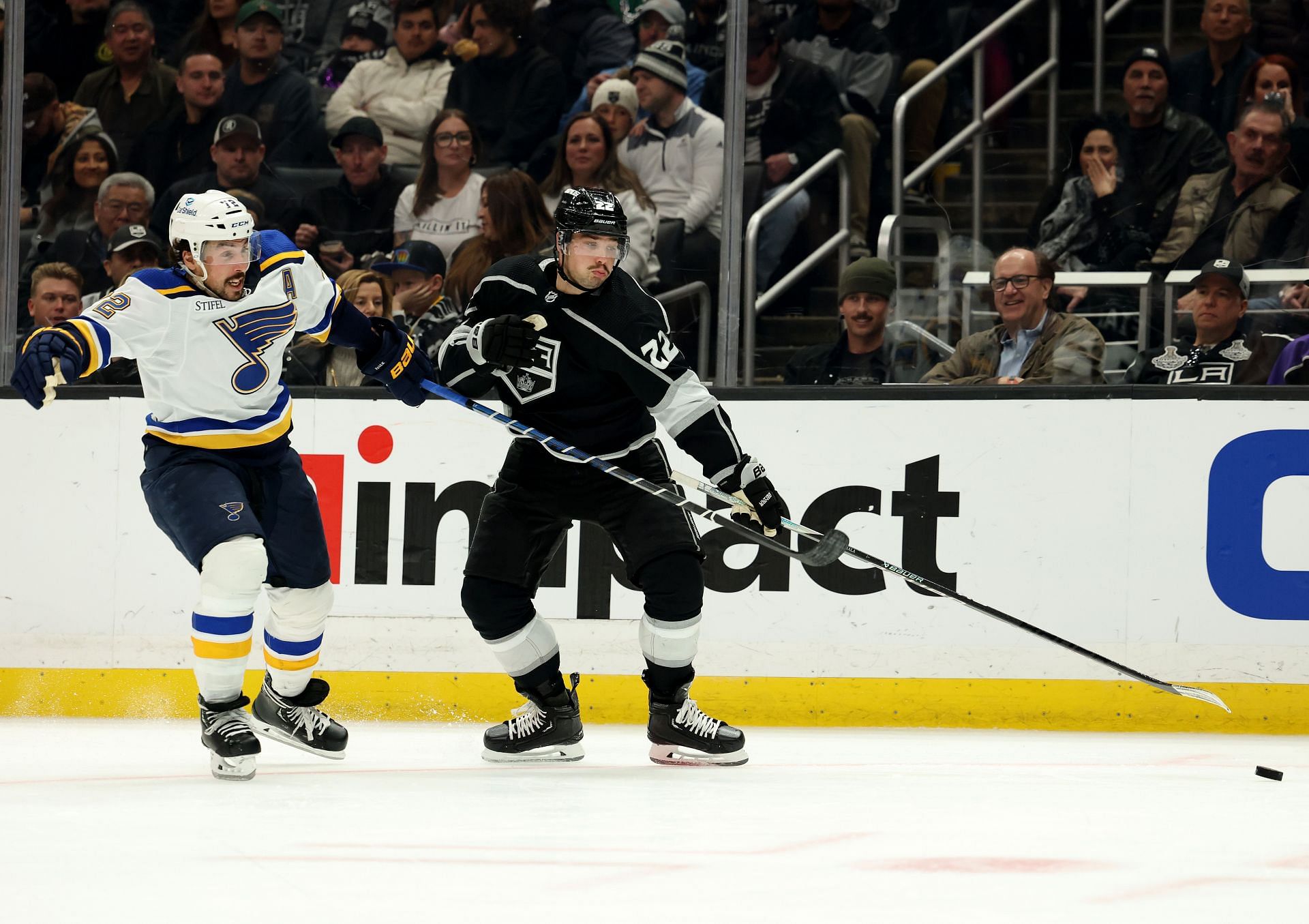 Kevin Fiala #22 of the Los Angeles Kings collides with Logan Brown #22 of the St. Louis Blues going after the puck during the second period at Crypto.com Arena on March 04, 2023 in Los Angeles, California. (Photo by Harry How/Getty Images)