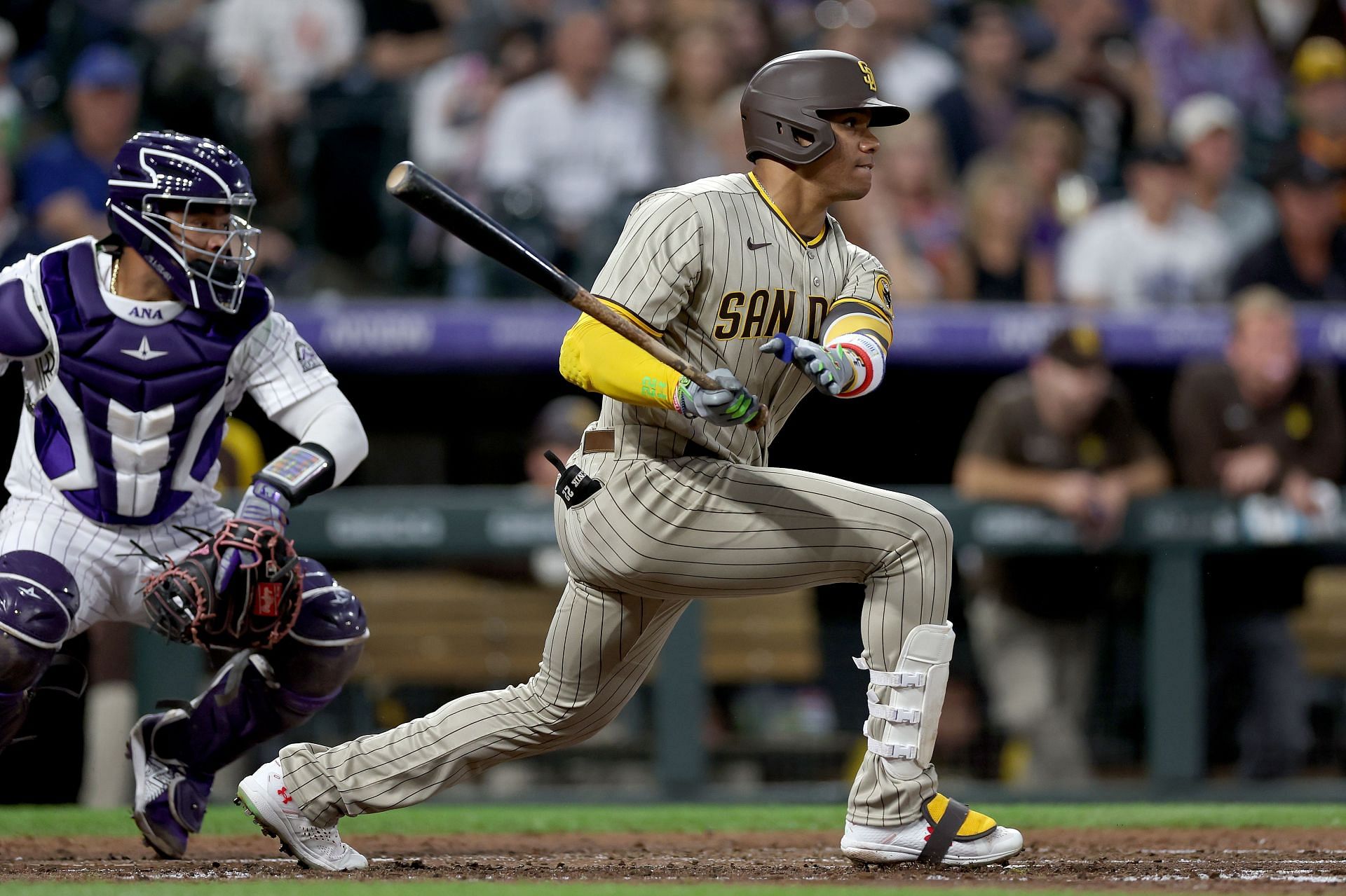 Juan Soto of the San Diego Padres hits a ground out RBI against the Colorado Rockies in the third inning at Coors Field