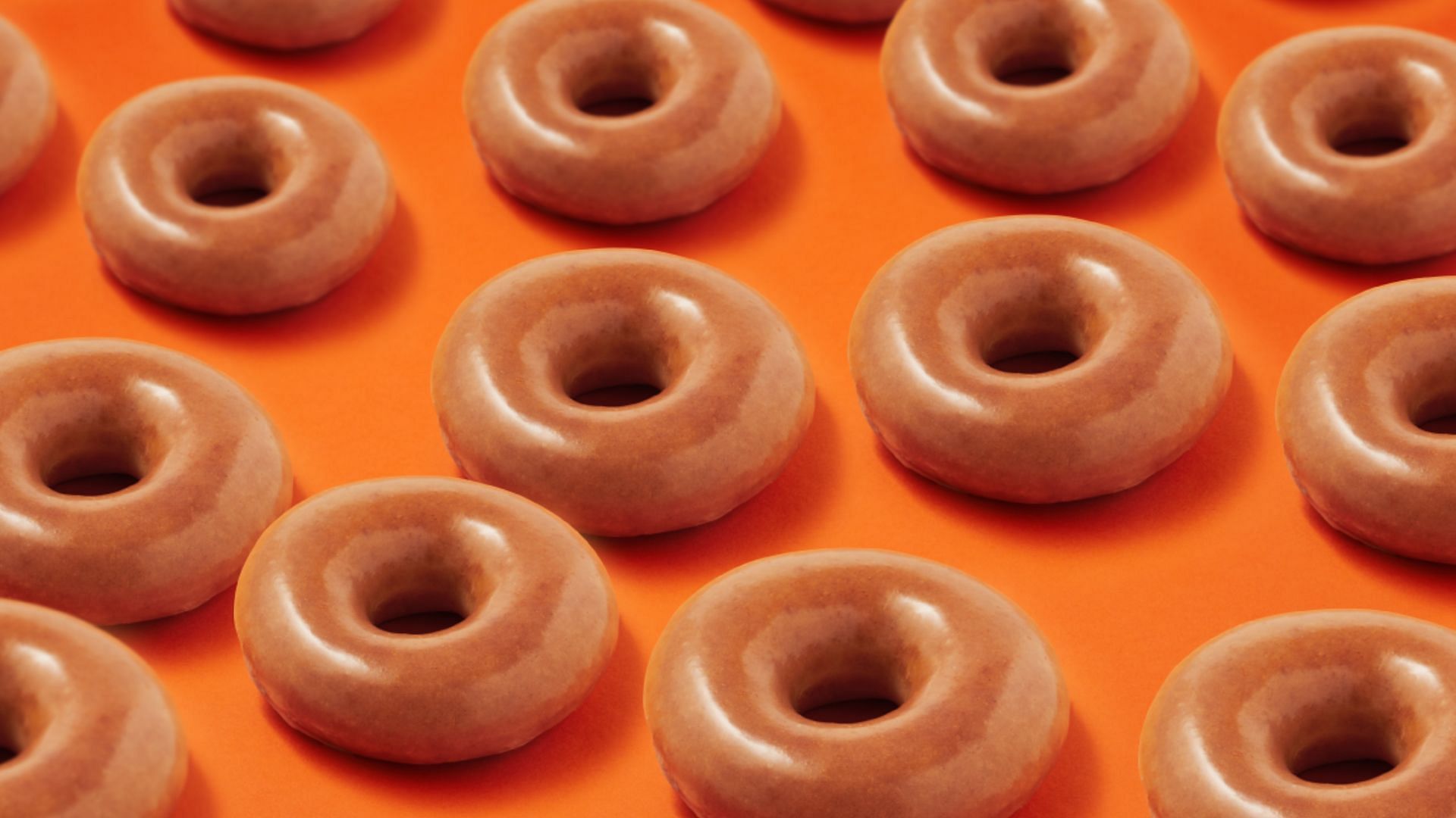the Pumpkin Spice Original Glazed Donuts will be available at all participating locations on April 1, 2023 and April 2, 2023 (Image via Krispy Kreme)