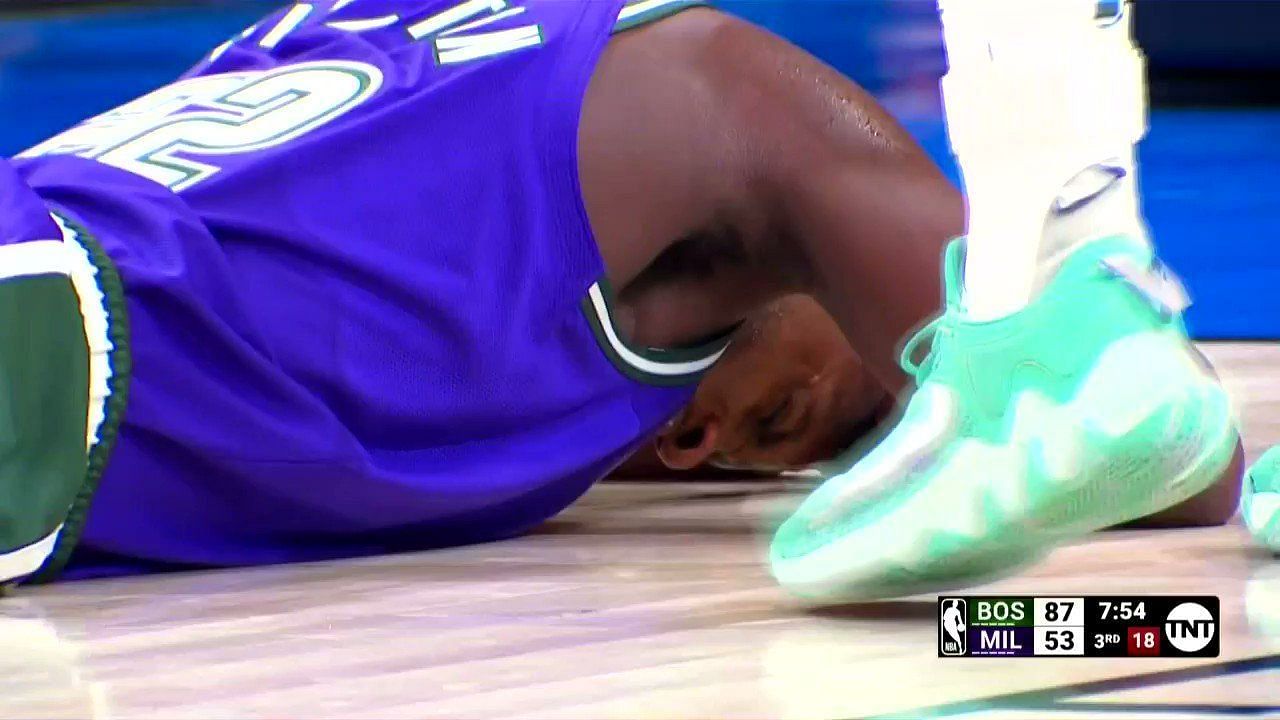 Milwaukee Bucks star wing Khris Middleton laying on the court following a face injury on Thursday night against Boston