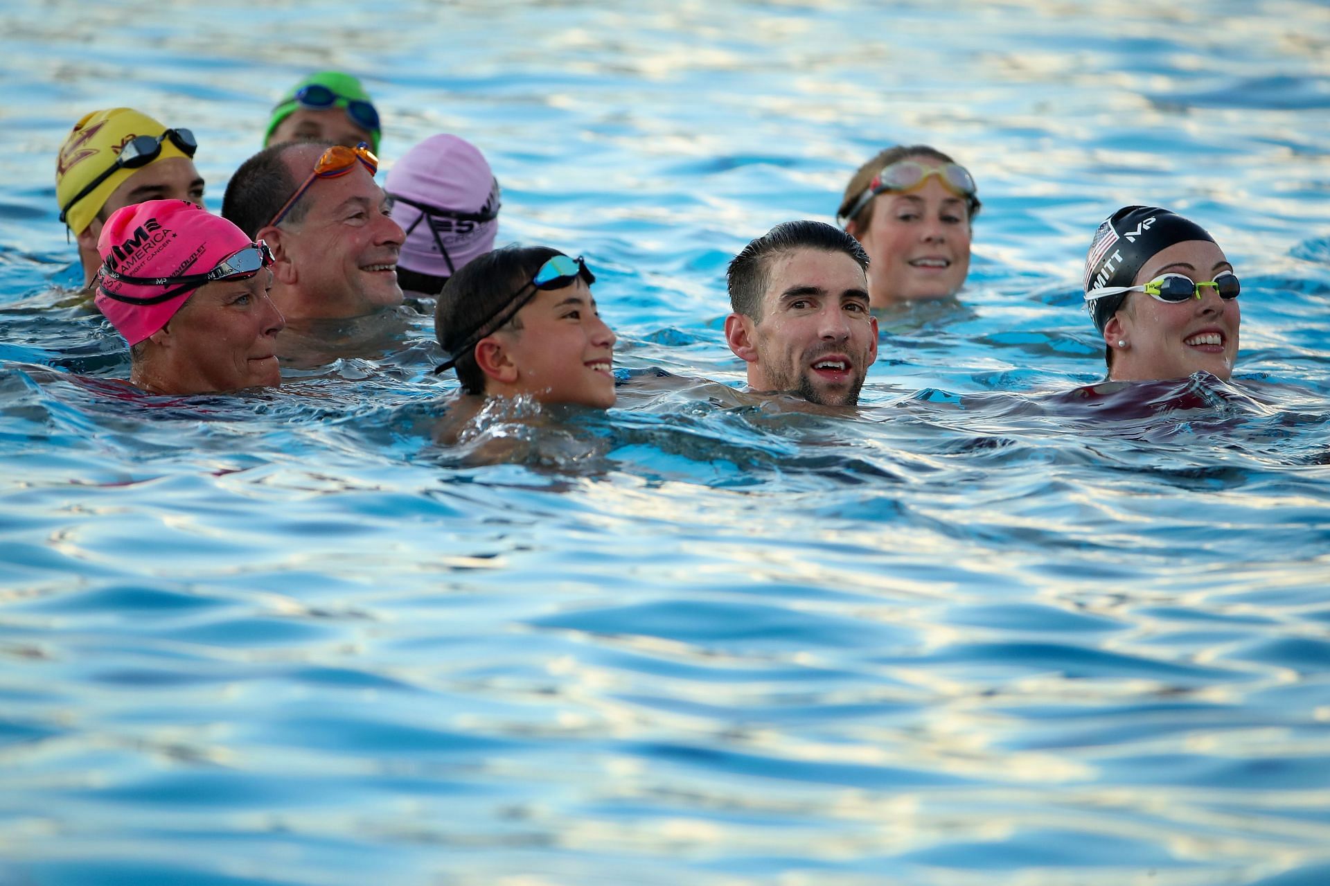 Michael Phelps and three-time Olympian Allison Schmitt participate in a charity swim (Photo by Christian Petersen/Getty Images)