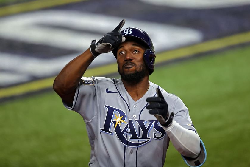 Tampa Bay Rays player pose for photos as they celebrate their