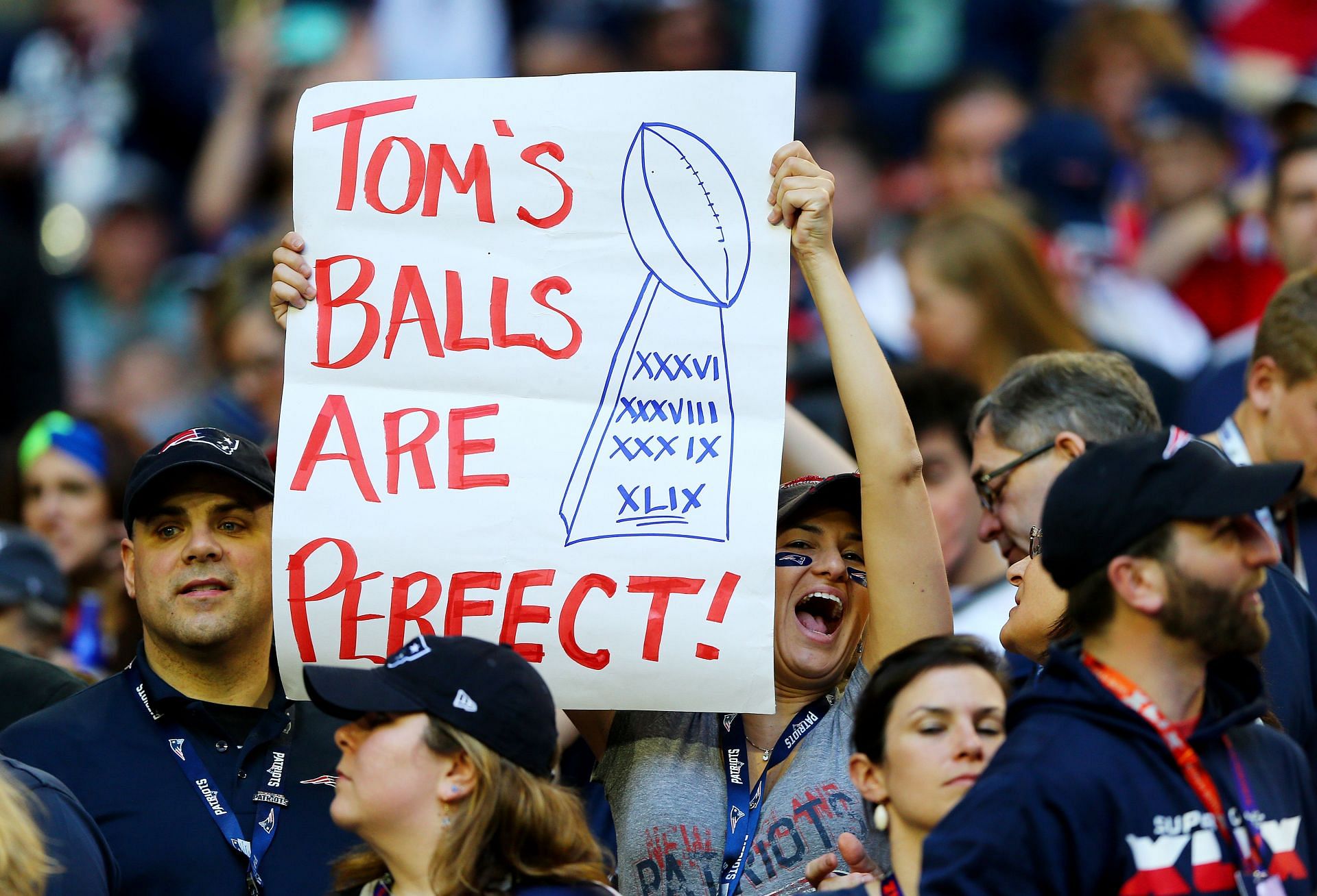 A New England Patriots fan cheering on her team and Tom Brady