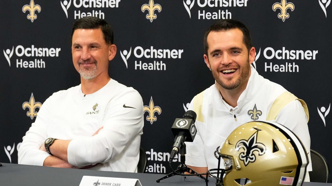 NFL QB Derek Carr (R) after signing with the New Orleans Saints