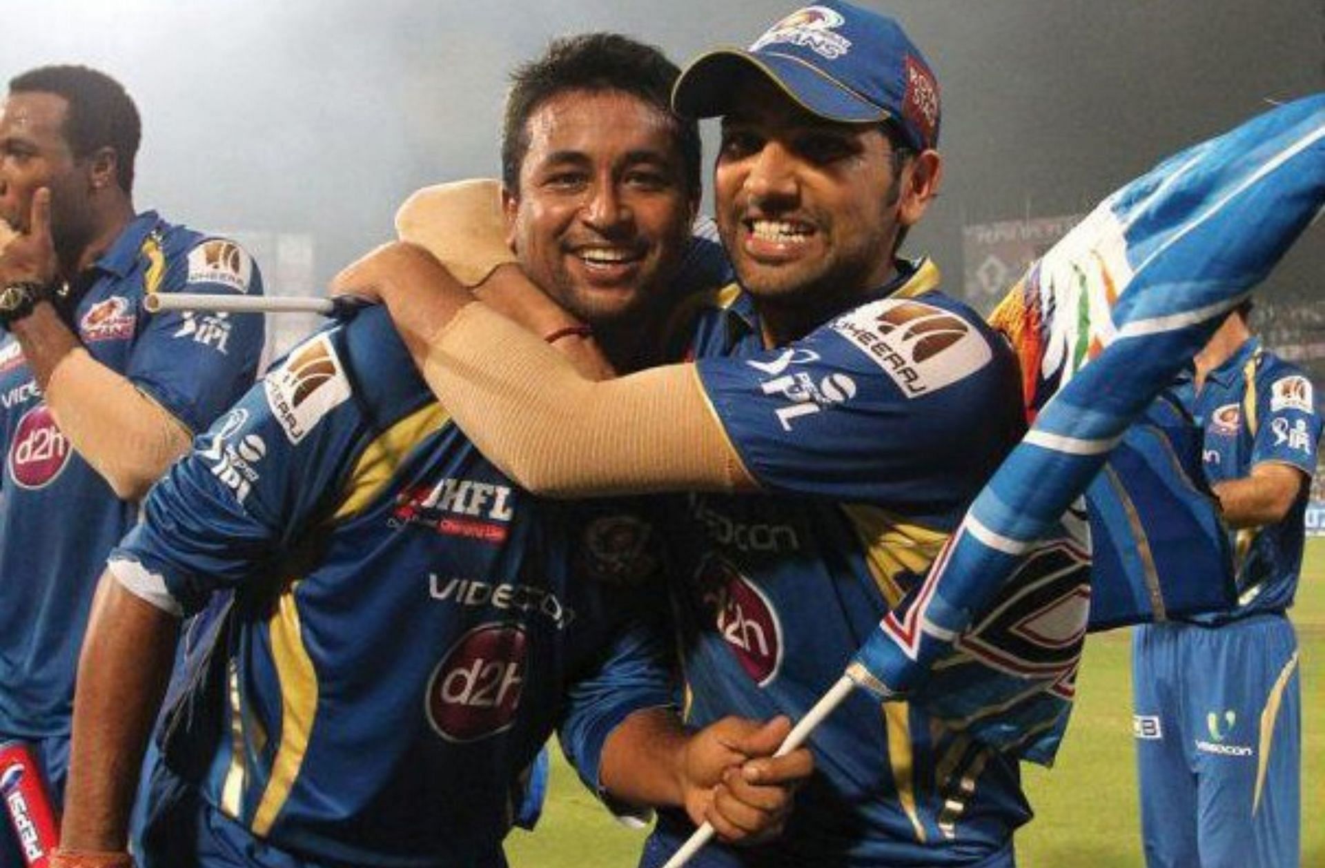 Pragyan Ojha and Rohit Sharma in MI colors in 2013 (PC: BCCI)