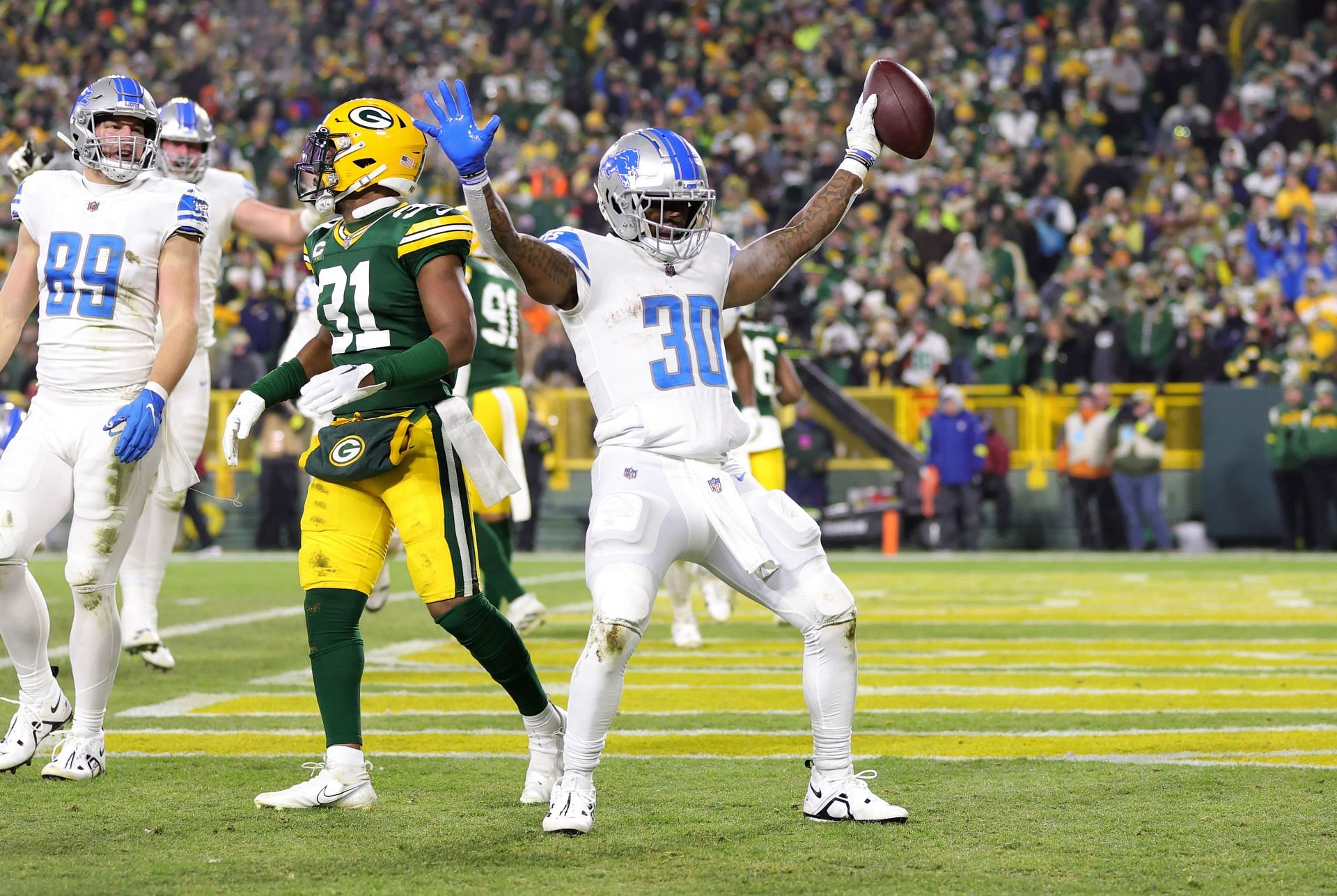 Jamaal Williams #30 celebrates a touchdown against the Green Bay Packers