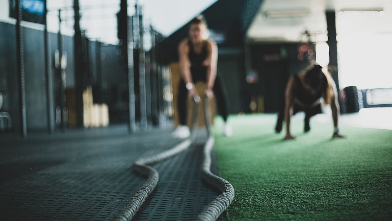 HIIT workout at home exercises include push-ups, pull-ups, or kettlebell swings to build lean muscle mass (Meghan Holmes/ Unsplash)