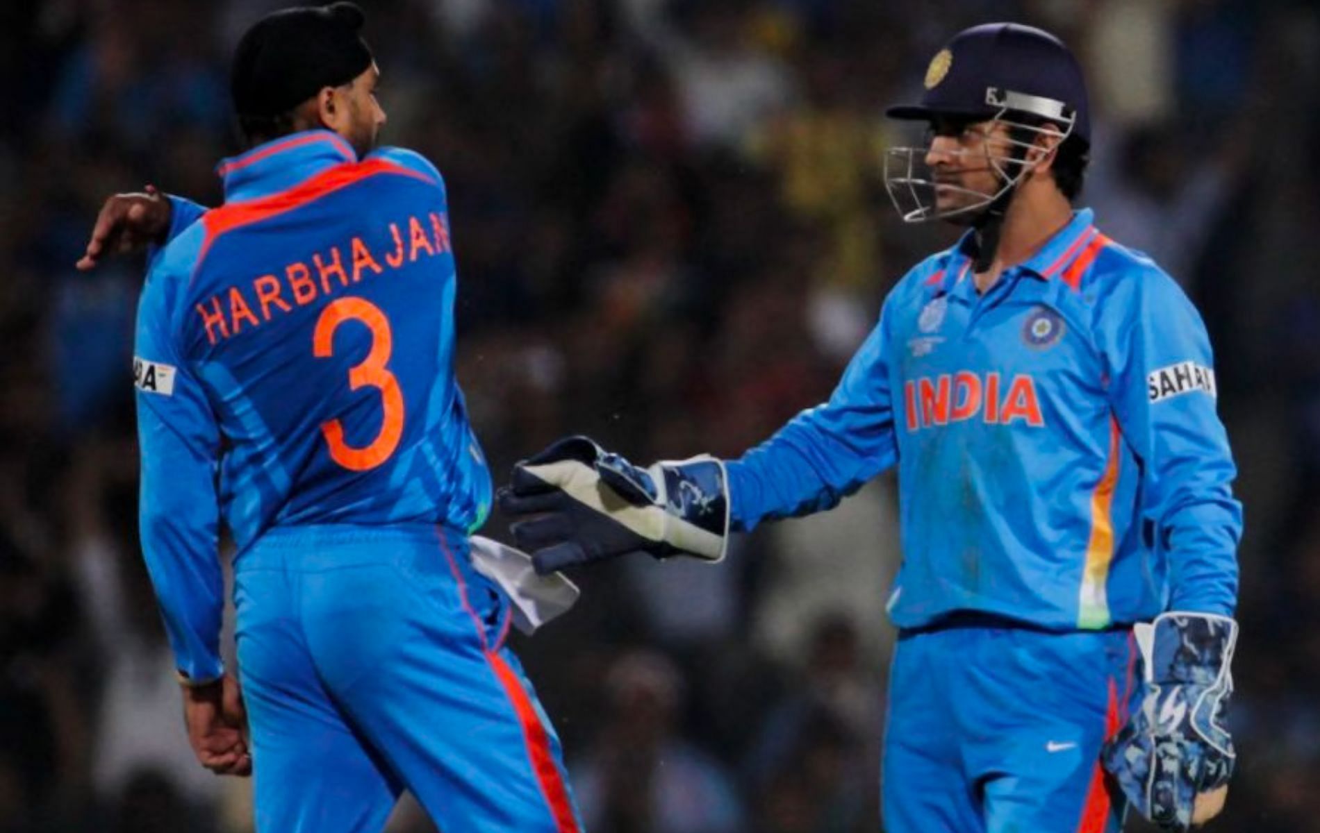 Harbhajan Singh (L) and MS Dhoni. (Pic: Getty)
