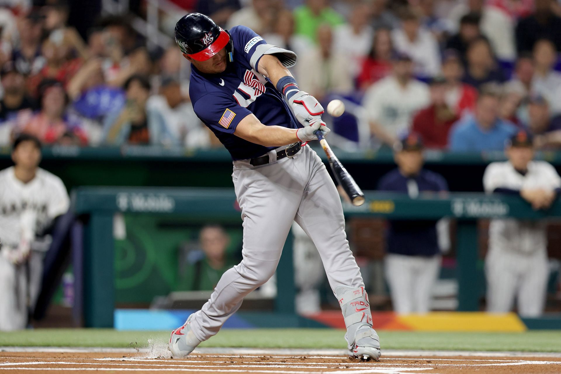 Mike Trout of Team USA hits a double in the first inning against Team Japan.