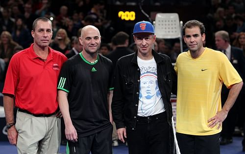 Andre Agassi (2L) and John McEnroe (2R) during an exhibition match at Madison Square Garden in 2011