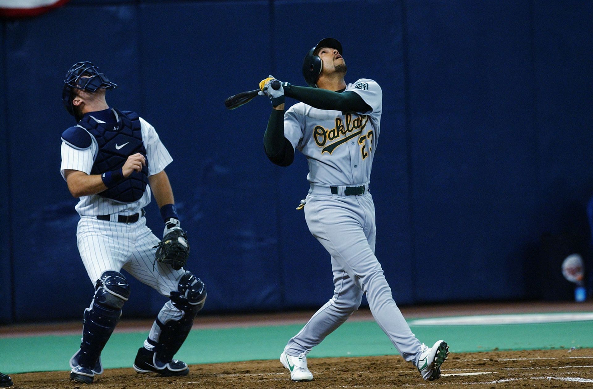 David Justice hits a fly ball: MINNEAPOLIS, MN - OCTOBER 5: David Justice #23 of the Oakland Athletics hits a fly ball during the American League Division Series against the Minnesota Twins on October 5, 2002, at the Hubert H Humphrey Dome in Minneapolis, Minnesota. (Photo by Matthew Stockman/Getty Images)