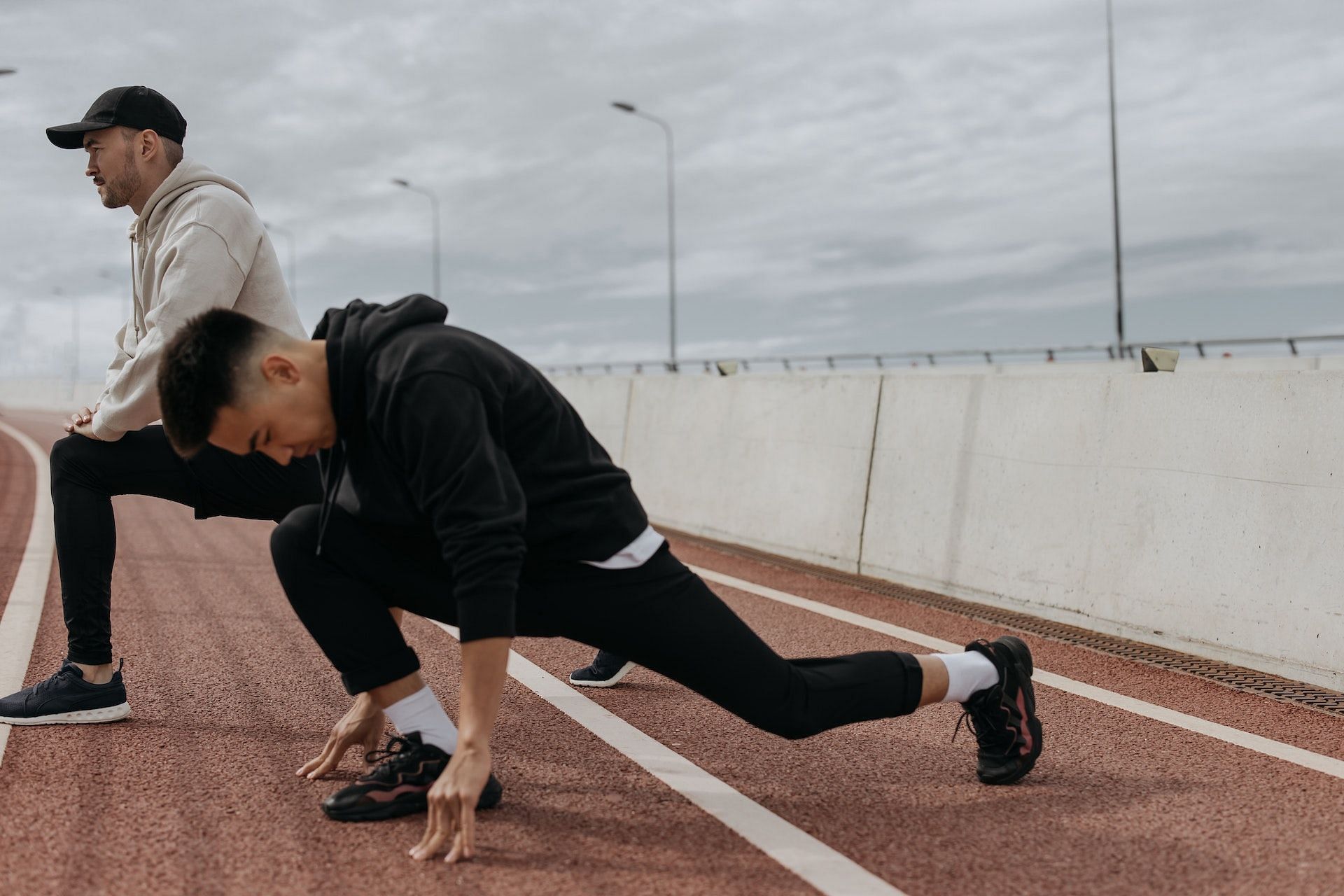 There are several stretches to do before running. (Photo via Pexels/cottonbro studio)