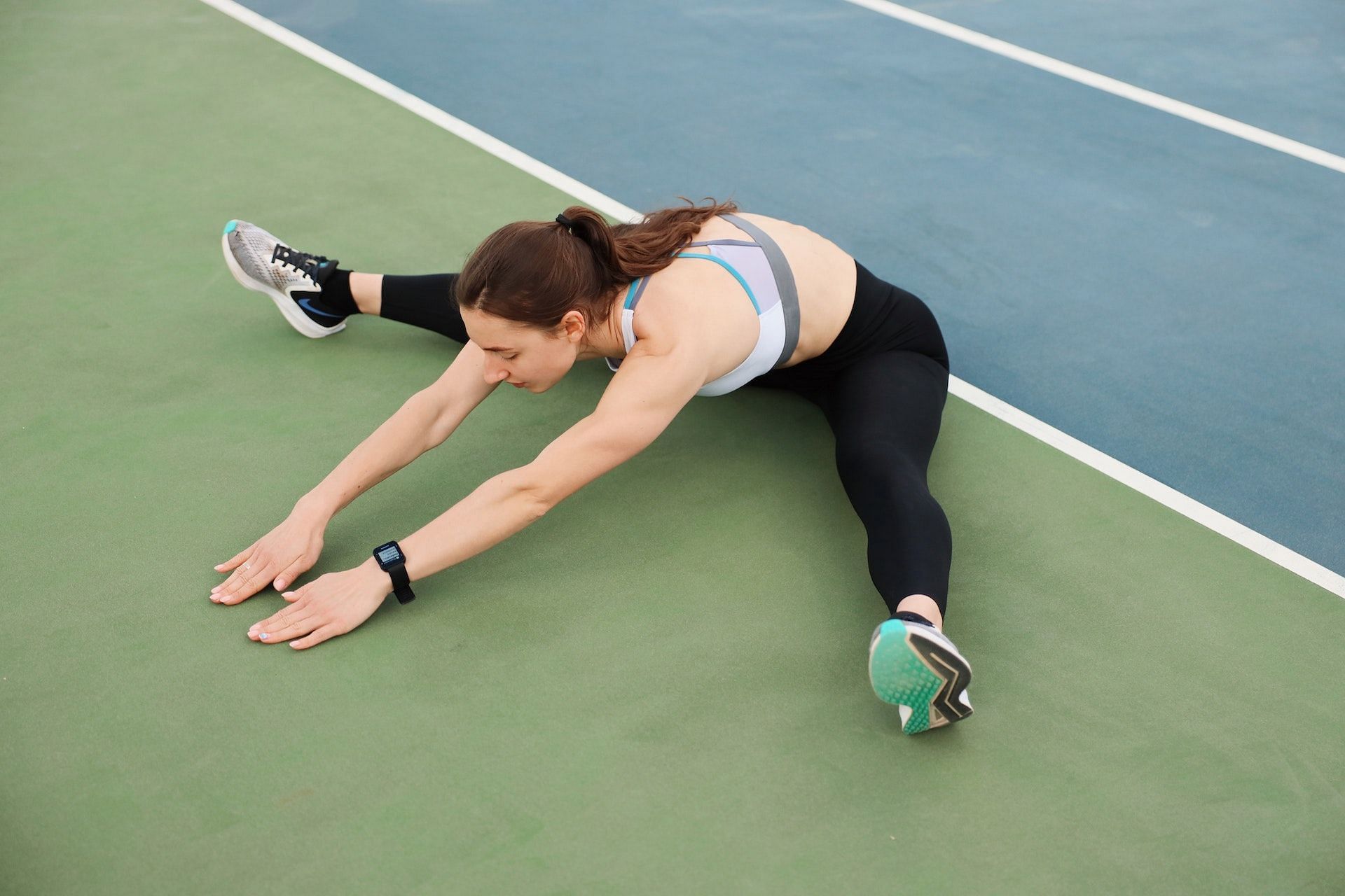 Stretching before running prevents injury. (Photo via Pexels/Maksim Goncharenok)