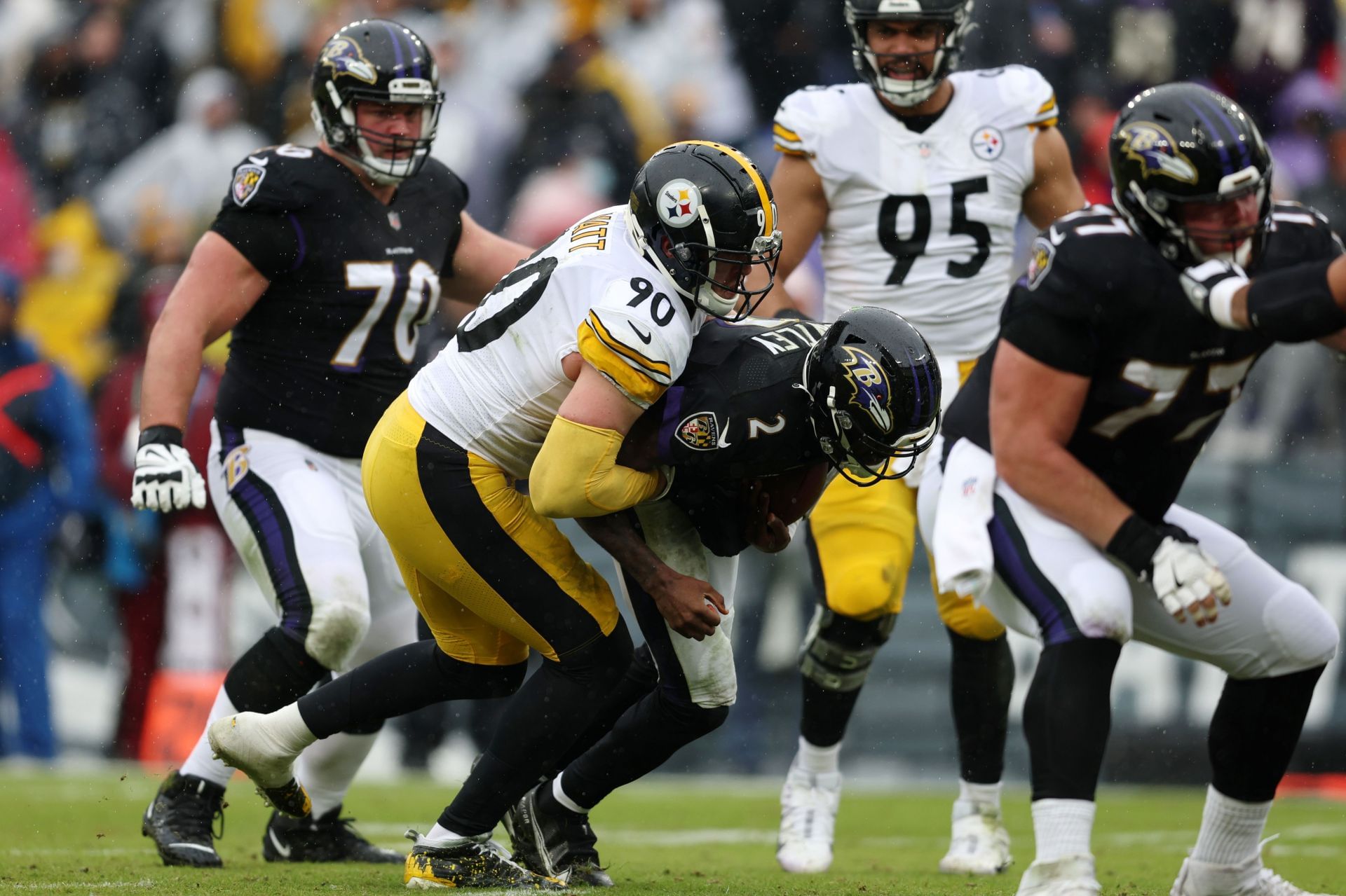 T.J. Watt #90 of the Pittsburgh Steelers sacks Tyler Huntley #2 of the Baltimore Ravens