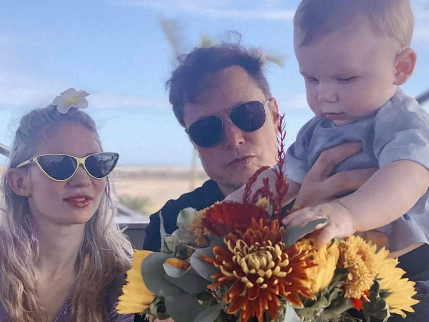 Grimes and Elon Musk with their son X (Image via Twitter/@elonmusk)