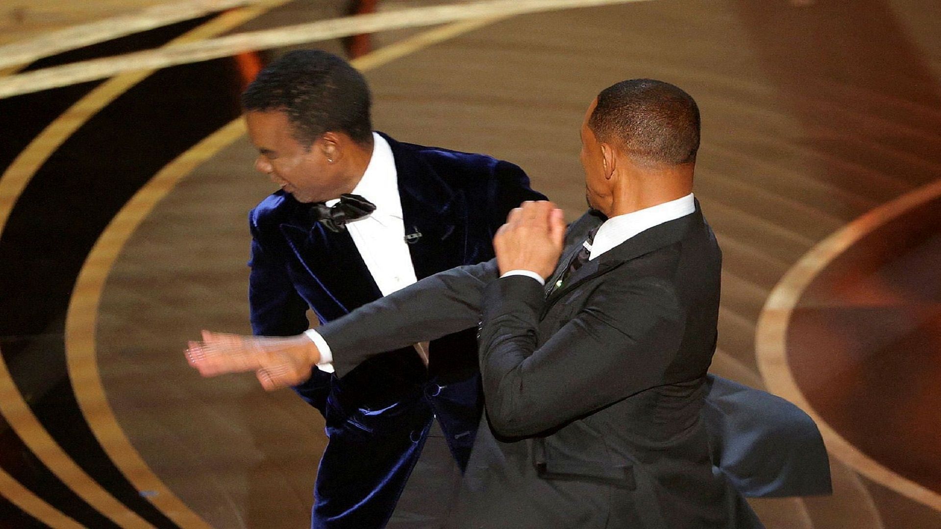 The viral moment from the 2022 Oscars when Will Smith slapped Chris Rock (Image via Twitter/ @SharionSade)