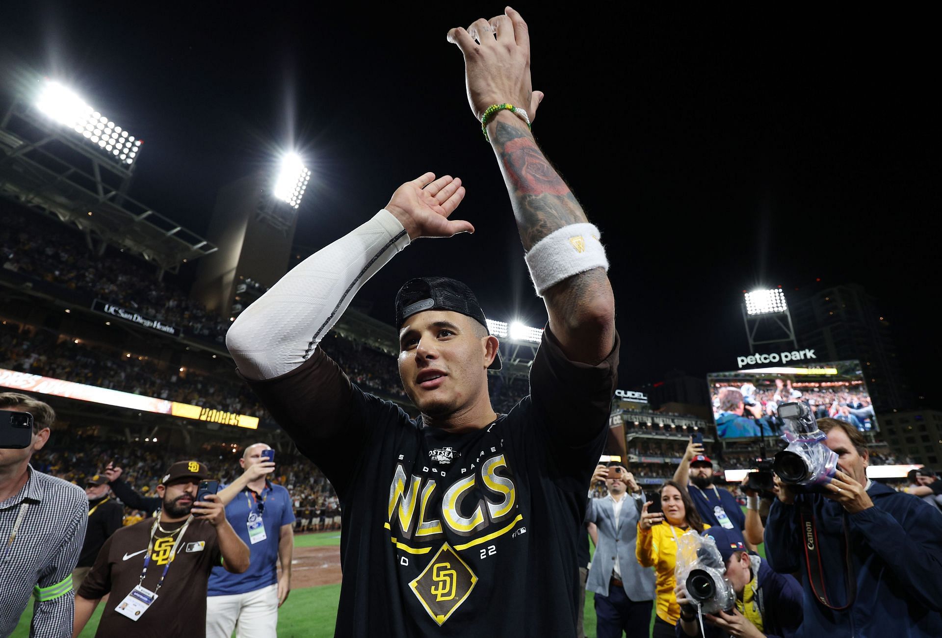 Manny Machado celebrates defeating the Los Angeles Dodgers 5-3 in game four of the NLDS at PETCO Park