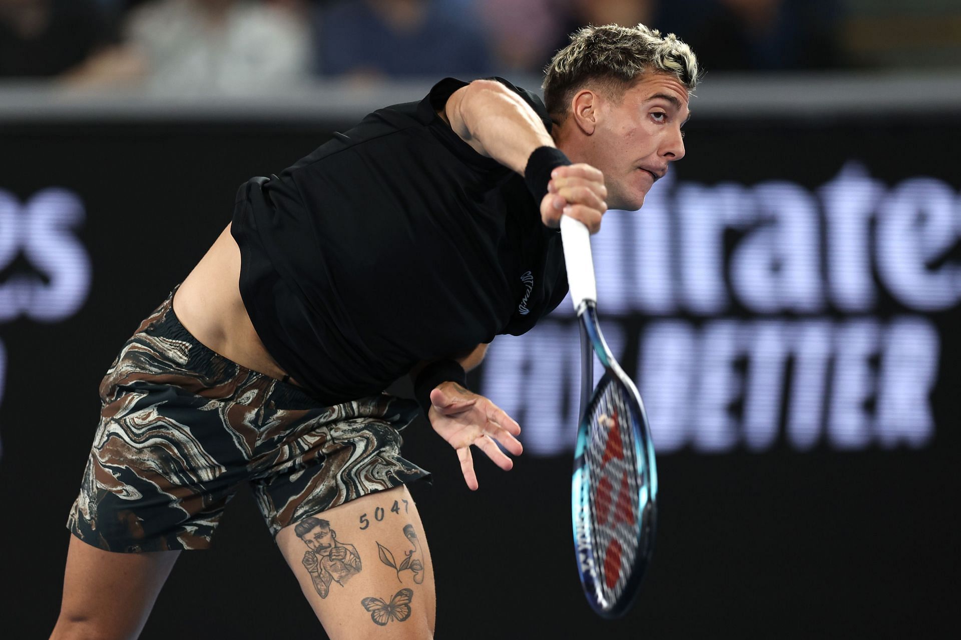 Kokkinakis serves at the 2023 Australian Open.