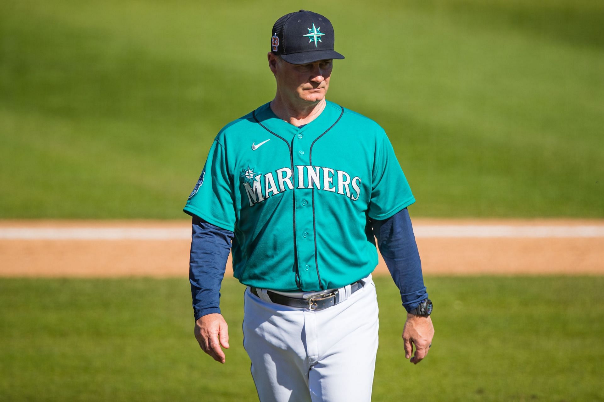 Manager Scott Servais of the Seattle Mariners walks to the dugout after making a pitching change