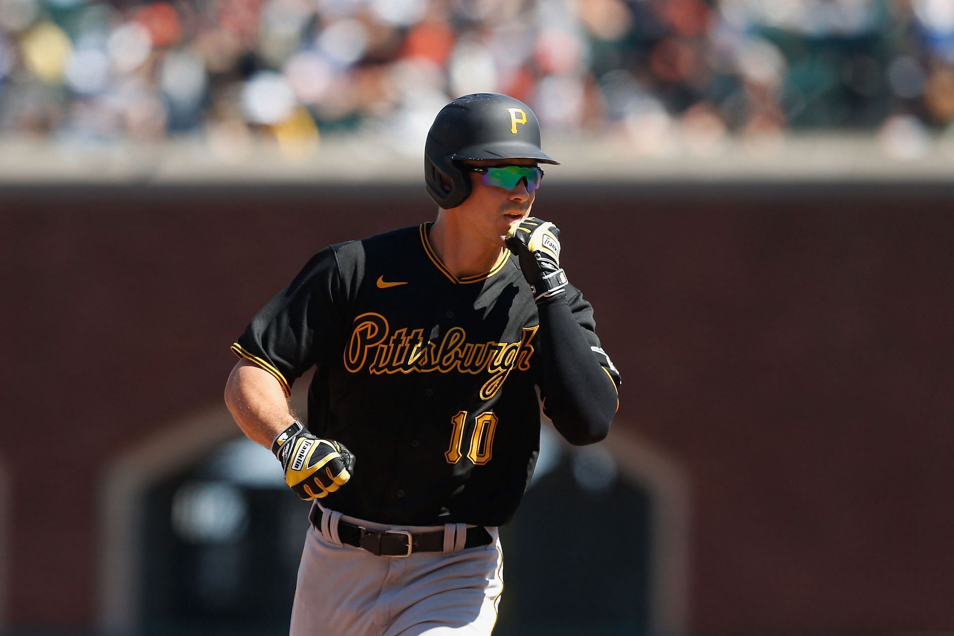 Bryan Reynolds of the Pittsburgh Pirates reacts as he rounds the bases after hitting a three-run home run.