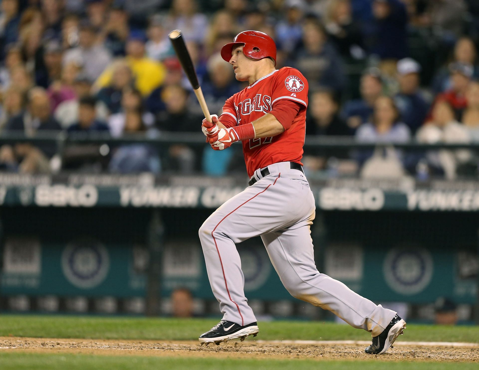 Mike Trout #27 of the Los Angeles Angels of Anaheim triples for his fourth hit of the game in the sixth inning against the Seattle Mariners at Safeco Field on October 1, 2012 in Seattle, Washington