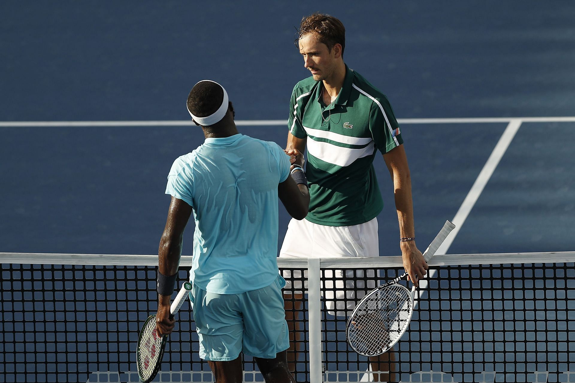 Frances Tiafoe (L) and Daniil Medvedev