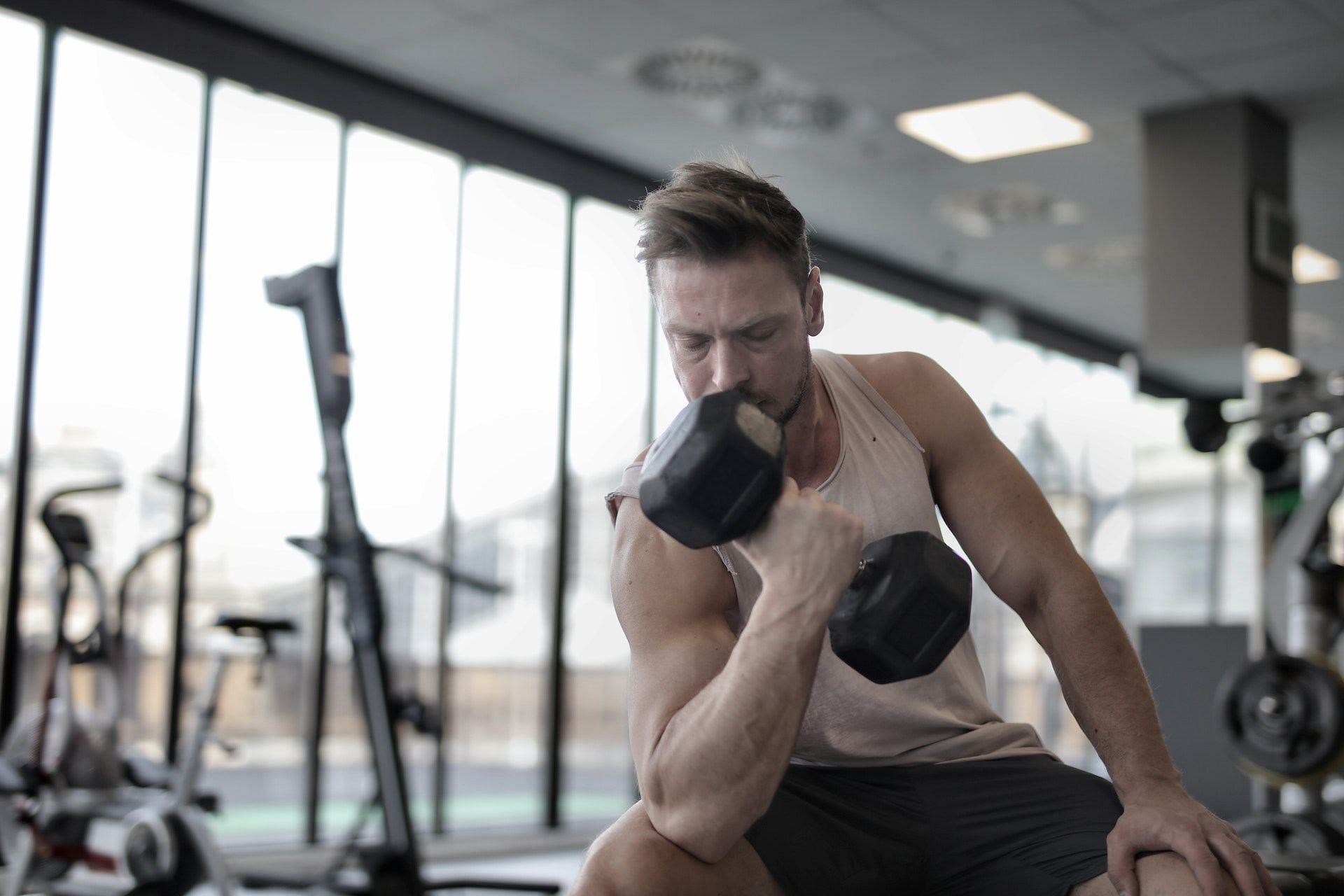 Concentration curls are the most productive short head bicep exercises that eliminate leg and upper back involvement. (Photo via Pexels/Andrea Piacquadio)