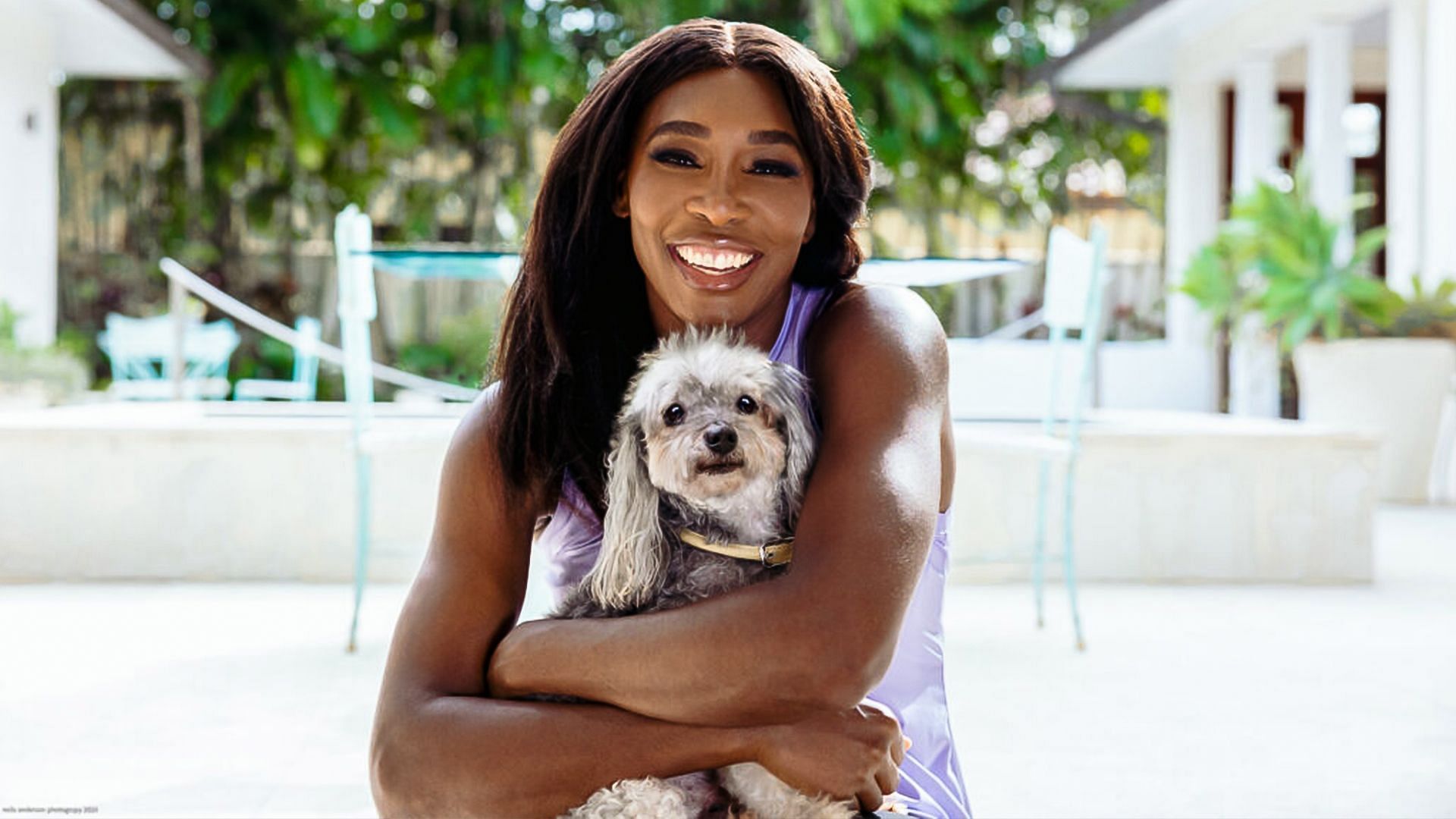 Venus Williams poses with her pet dog