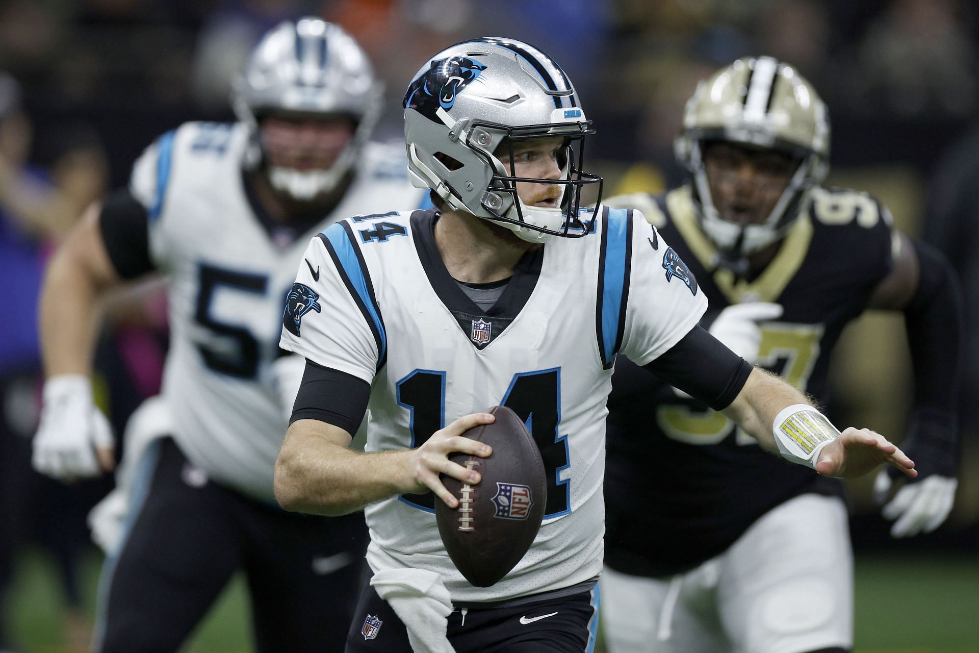 Sam Darnold #14 of the Carolina Panthers scrambles with the ball during the third quarter against the New Orleans Saints