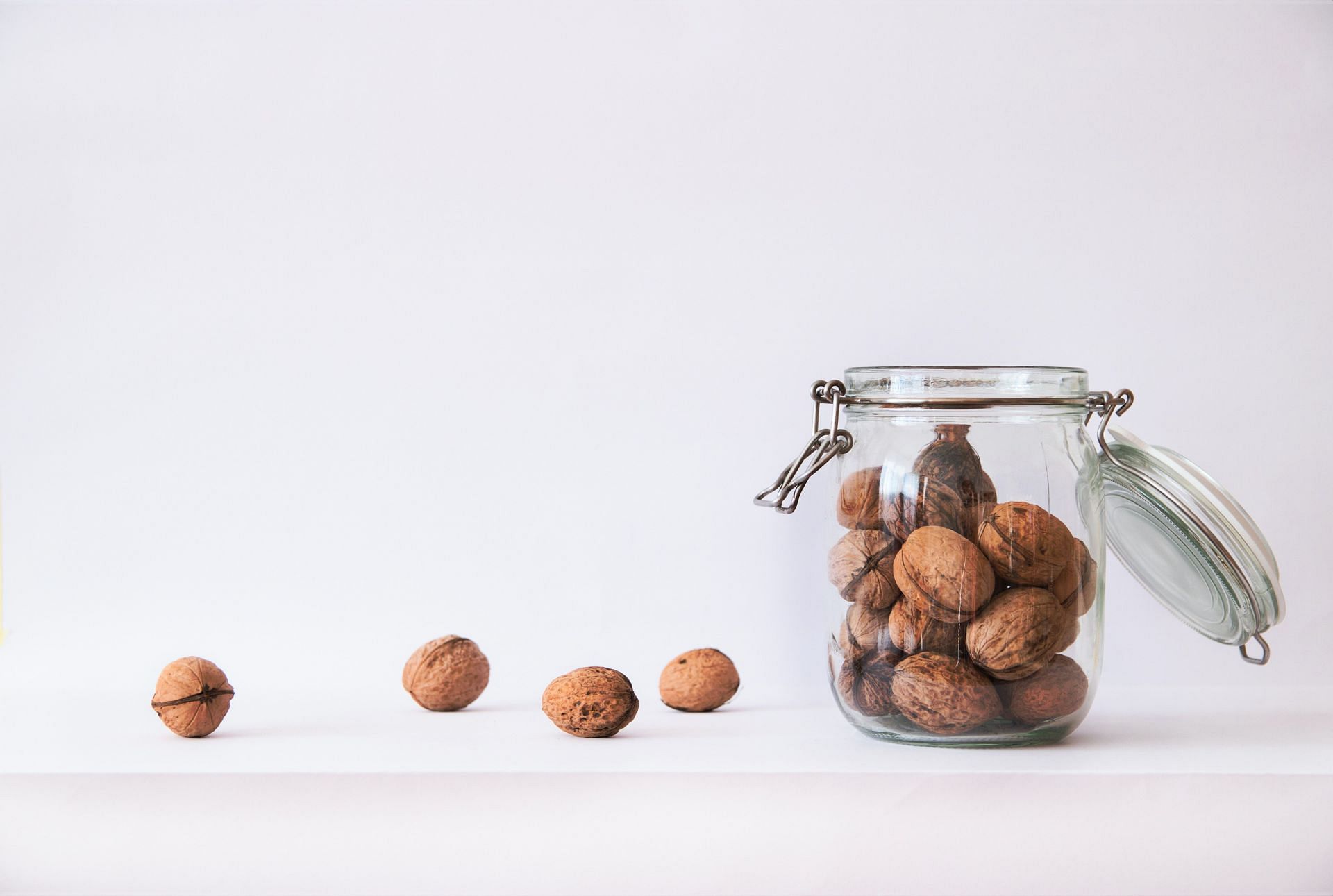 Walnuts packed with benefits in a jar (Image via Pexels)