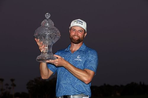 Chris Kirk stands with the Honda Classic trophy after the Final Round