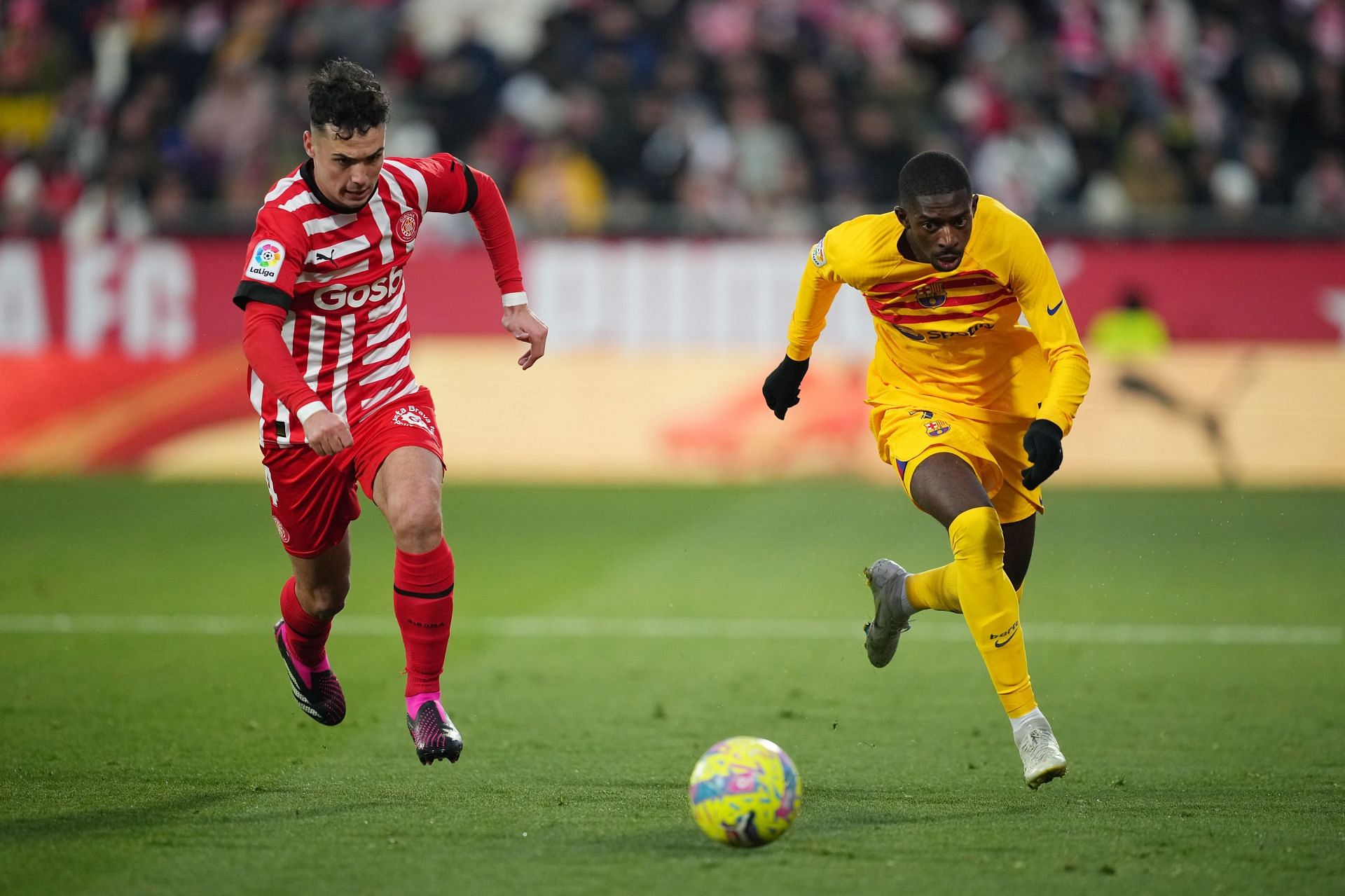 Dembele (R) in action against Girona.