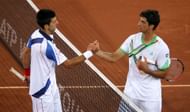 Thomaz Bellucci (R) congratulates the World No. 1