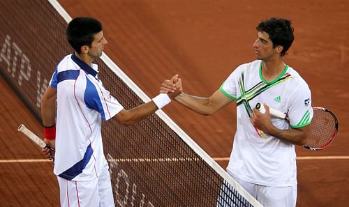 Thomaz Bellucci (R) congratulates the World No. 1