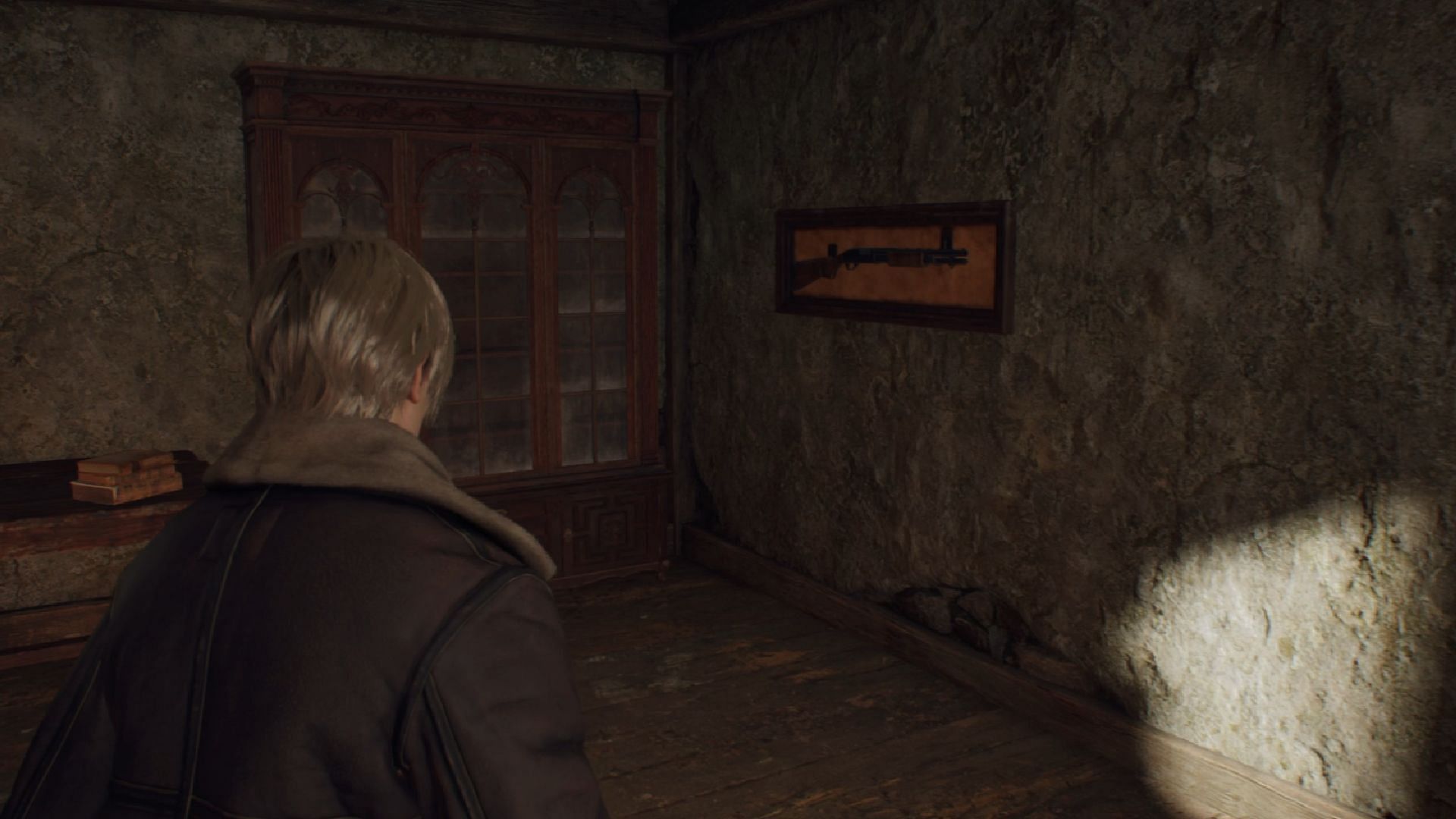 The W-870 shotgun is hung on the wall on the upper floor (Image via Capcom)