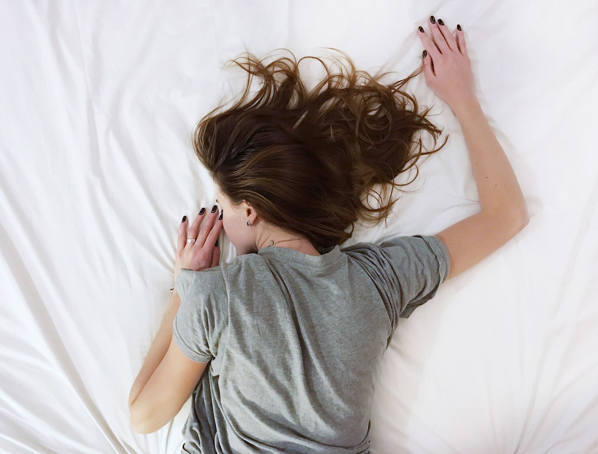 Sleeping on stomach can impact your health. (Image via Unsplash/ Vlasislav Muslakov)