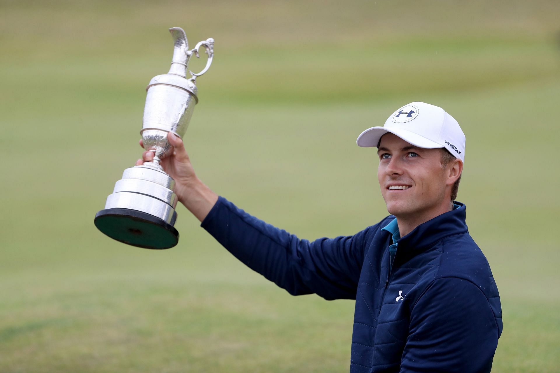 On July 23, 2017, in Southport, England, during the final round of the 146th Open Championship at Royal Birkdale, Jordan Spieth celebrates his victory by posing with the Claret Jug.