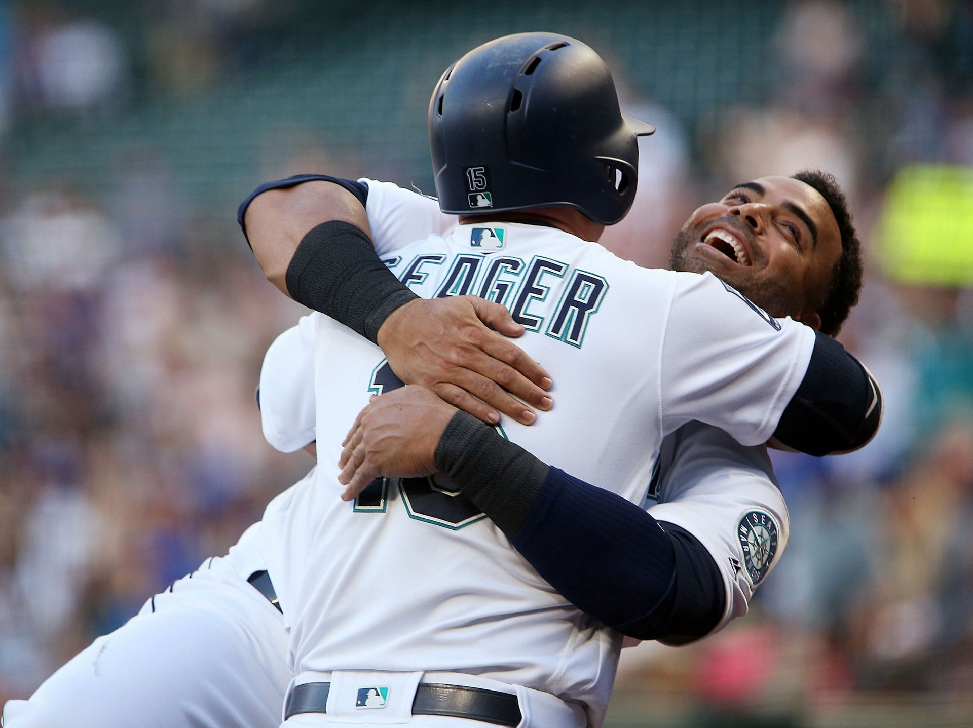 Kyle Seager #15 of the Seattle Mariners gets a hug from Nelson Cruz #23 after hitting a solo home run in the second inning against the Boston Red Sox at Safeco Field on July 24, 2017 in Seattle, Washington. (Photo by Lindsey Wasson/Getty Images)