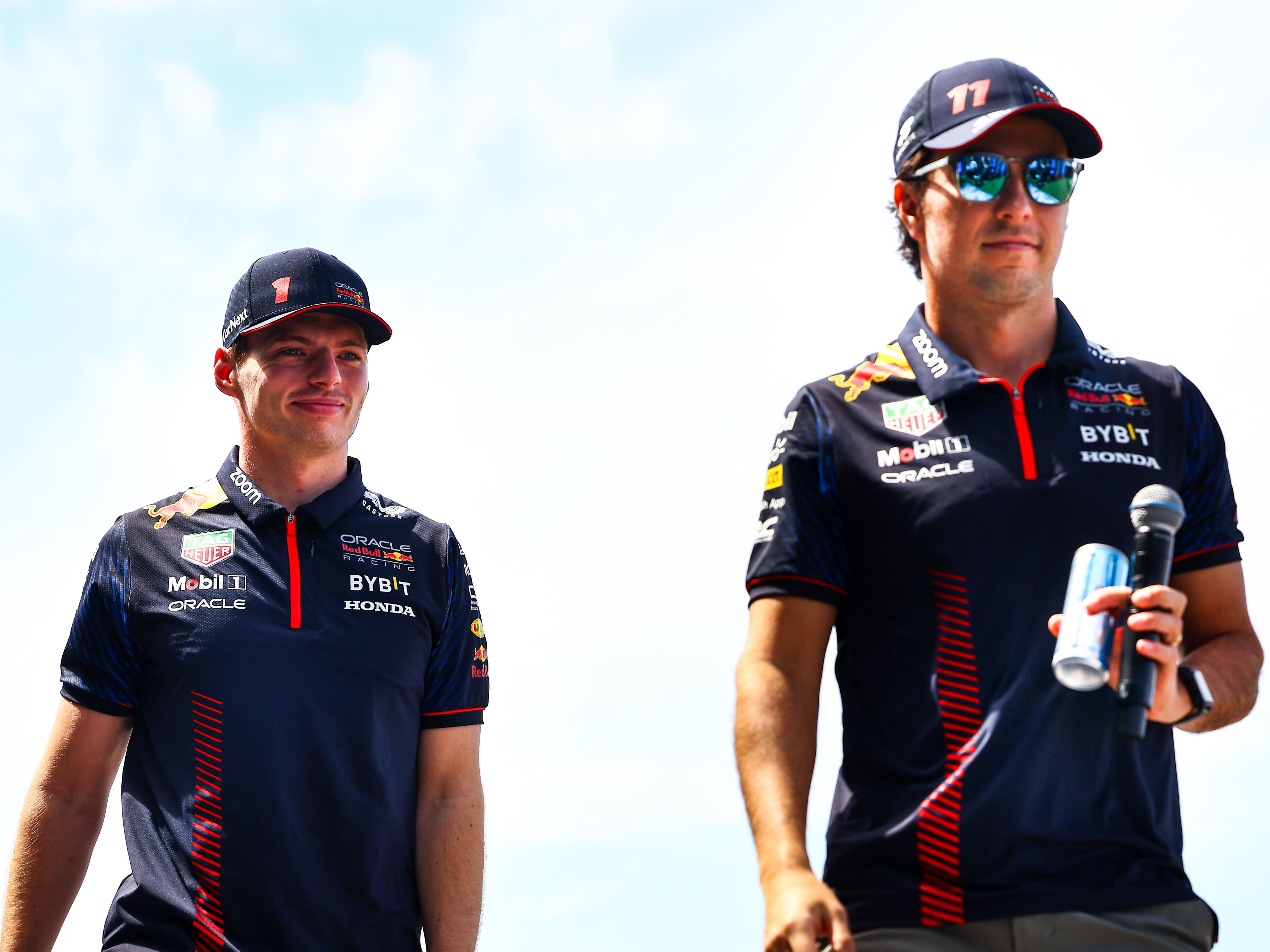Max Verstappen and Sergio Perez look on from the fan stage prior to final practice ahead of the 2023 F1 Saudi Arabian Grand Prix (Photo by Mark Thompson/Getty Images)